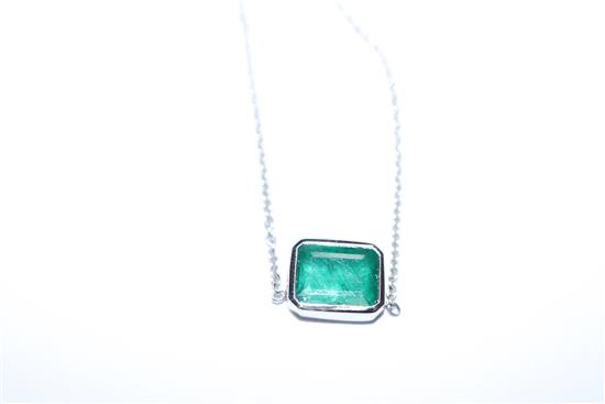 An 18ct white gold and solitaire emerald set pendant necklace, pendant 9mm.